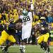 Michigan senior quarterback Denard Robinson looks to throw against Michigan State nose tackle Anthony Rashad White on Saturday. Daniel Brenner I AnnArbor.com